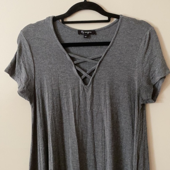 Knee length grey dress with neckline details. - Picture 2 of 3